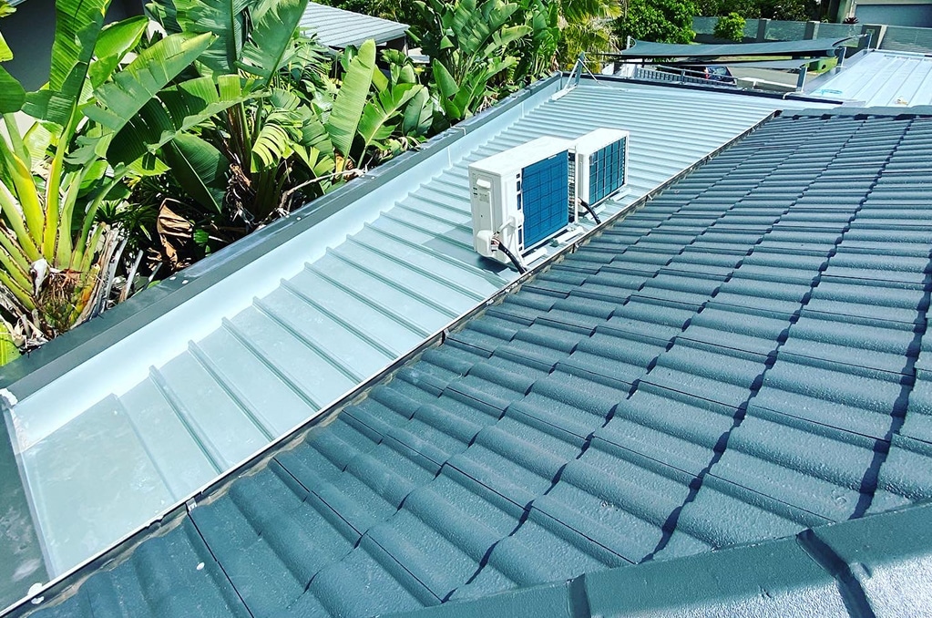Aircon Condenser on a Roof — Ryan Roofing Australia In Court Carrara, QLD