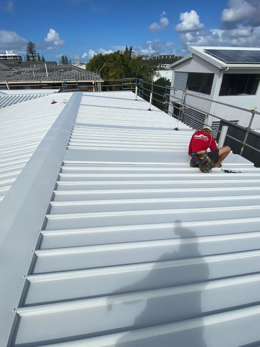 Professional Roofer Taking Photo — Ryan Roofing Australia In Court Carrara, QLD