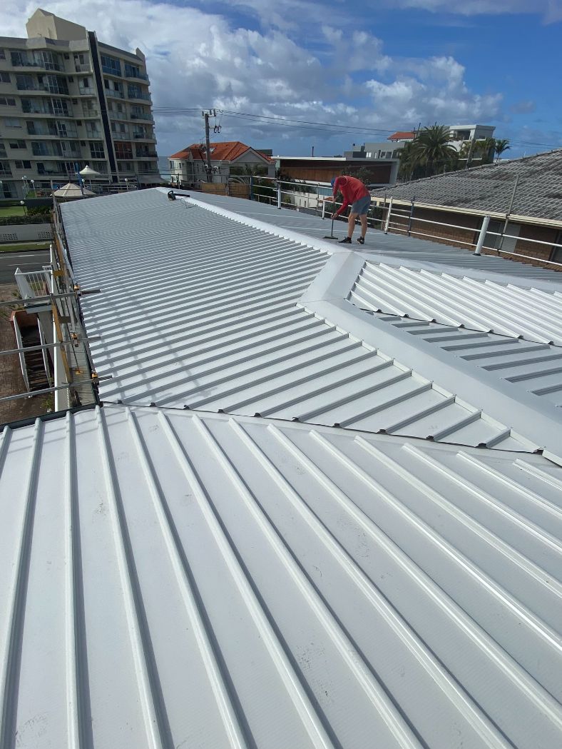 Cleaning Metal Roof — Ryan Roofing Australia In Court Carrara, QLD